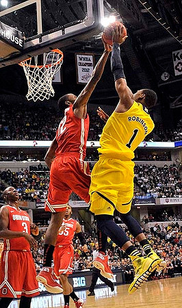 LaVall Jordan, Mitch McGary (4), and John Beilein