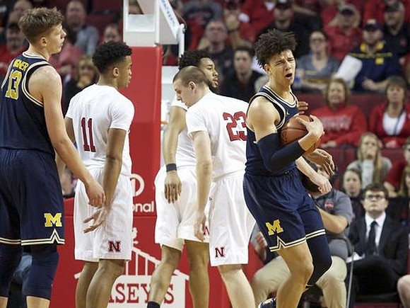 Moritz Wagner (13) and D.J. Wilson (5)