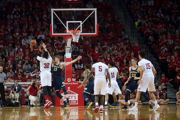 Moritz Wagner (13), Xavier Simpson (3), and Duncan Robinson (22)