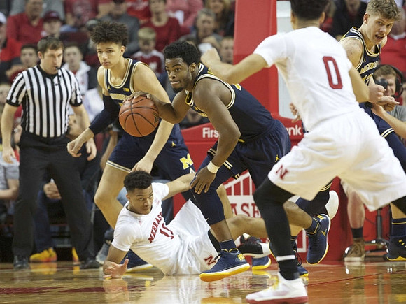 Derrick Walton Jr. (10) and Moritz Wagner (13)