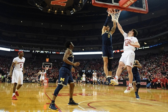 Derrick Walton Jr. (10) and D.J. Wilson (5)