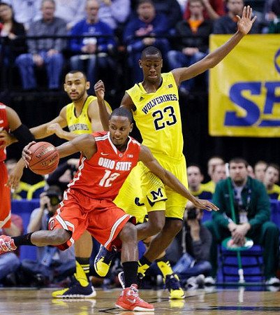 Jon Horford (15) and Caris LeVert (23)