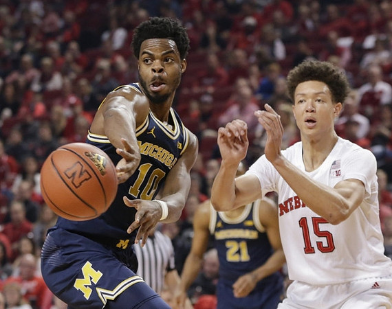 Derrick Walton Jr. (10) and Zak Irvin (21)