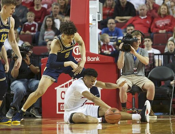 Moritz Wagner (13) and D.J. Wilson (5)