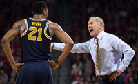 Zak Irvin (21) and John Beilein