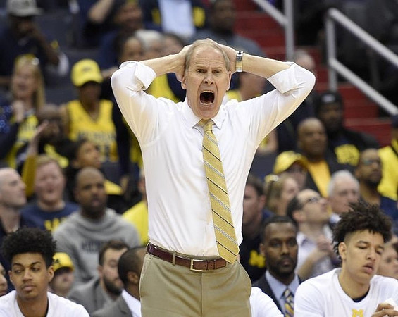 Ibi Watson (23), John Beilein, and D.J. Wilson (5)