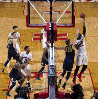 Duncan Robinson (22), Derrick Walton Jr. (10), Xavier Simpson (3), and Moritz Wagner (13)