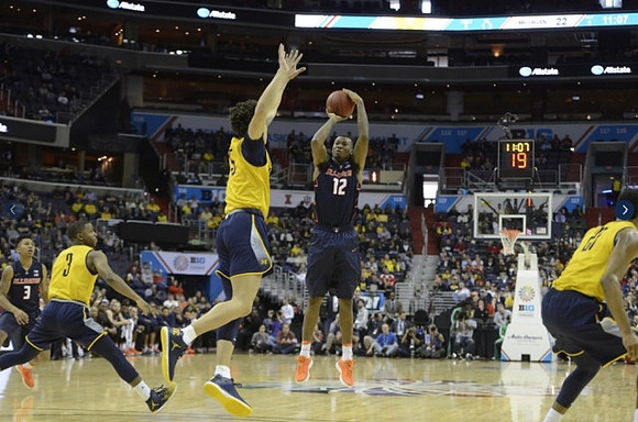 Xavier Simpson (3), D.J. Wilson (5), and Derrick Walton Jr. (10)