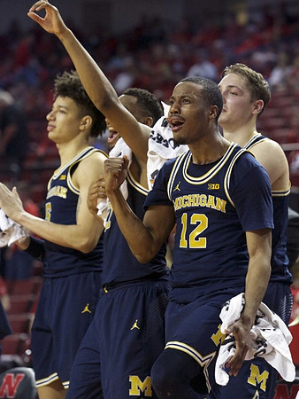 D.J. Wilson (5), Zak Irvin (21), Mark Donnal (34), and Muhammad-Ali Abdur-Rahkman (12)