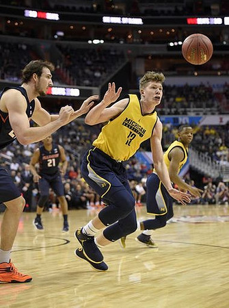 Moritz Wagner (13) and Xavier Simpson (3)