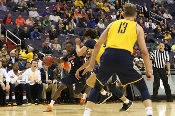 D.J. Wilson (5) and Moritz Wagner (13)