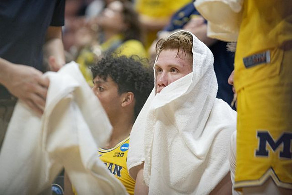 Eli Brooks (55) and Ignas Brazdeikis (13)