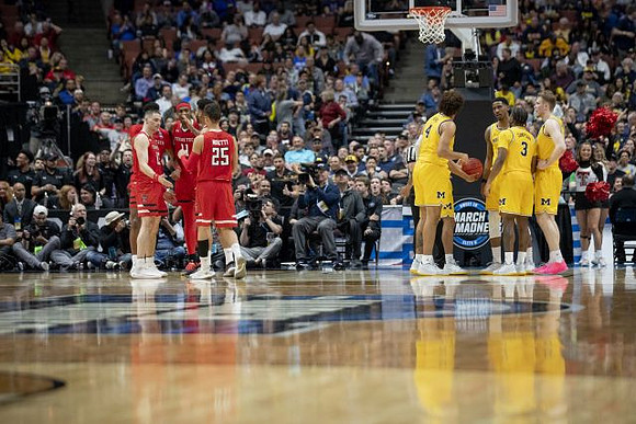 Isaiah Livers (4), Charles Matthews (1), Zavier Simpson (3), and Ignas Brazdeikis (13)