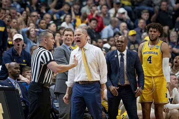 Luke Yaklich, John Beilein, Deandre Haynes, and Isaiah Livers (4)