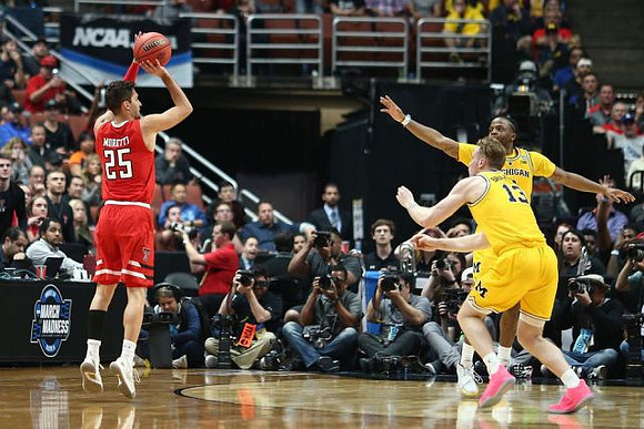 Ignas Brazdeikis (13) and Zavier Simpson (3)