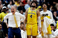 John Beilein, Isaiah Livers (4), and Jordan Poole (2)