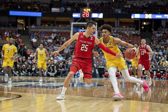 Zavier Simpson (3), Eli Brooks (55), Jordan Poole (2), and Isaiah Livers (4)