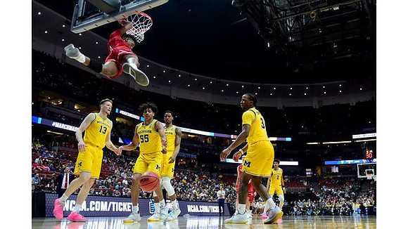 Ignas Brazdeikis (13), Eli Brooks (55), Charles Matthews (1), Zavier Simpson (3), and Jordan Poole (2)