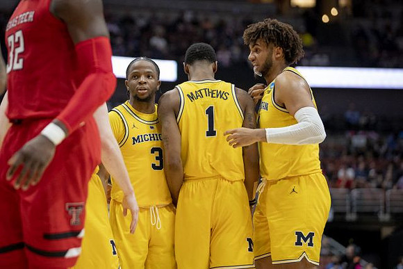 Zavier Simpson (3), Charles Matthews (1), and Isaiah Livers (4)