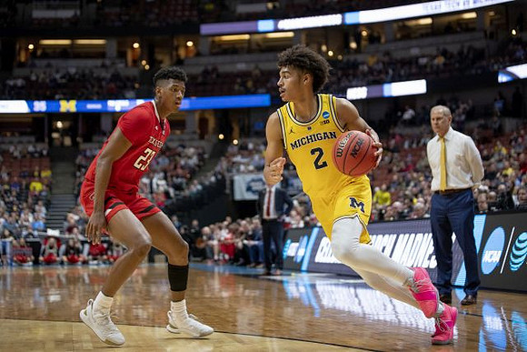Jordan Poole (2) and John Beilein