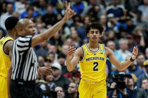 Charles Matthews (1) and Jordan Poole (2)