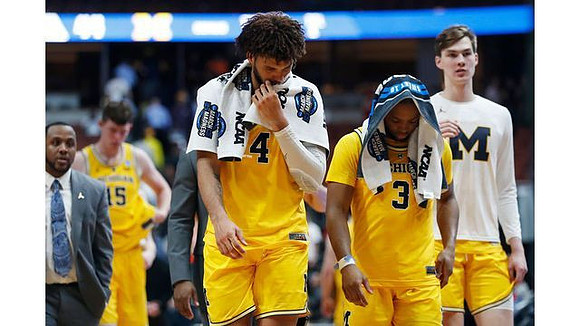Jon Teske (15), Isaiah Livers (4), Zavier Simpson (3), and Colin Castleton (11)