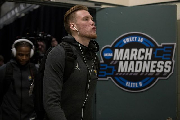 Ignas Brazdeikis (13) and Zavier Simpson (3)