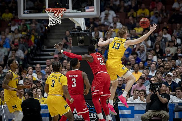 Charles Matthews (1), Zavier Simpson (3), and Ignas Brazdeikis (13)