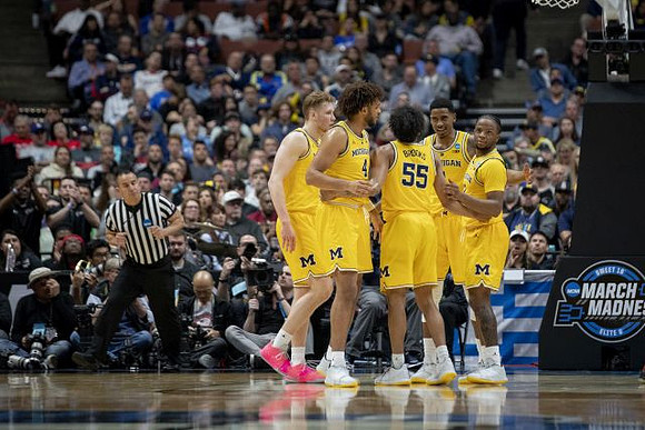 Ignas Brazdeikis (13), Isaiah Livers (4), Eli Brooks (55), Charles Matthews (1), and Zavier Simpson (3)