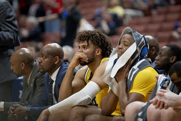 Saddi Washington, Deandre Haynes, Isaiah Livers (4), and Zavier Simpson (3)
