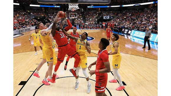 Zavier Simpson (3), Jon Teske (15), Ignas Brazdeikis (13), Charles Matthews (1), and Jordan Poole (2)