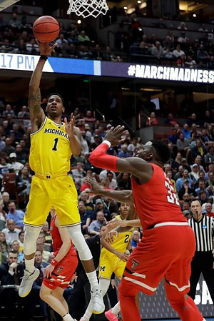 Charles Matthews (1) and Jordan Poole (2)