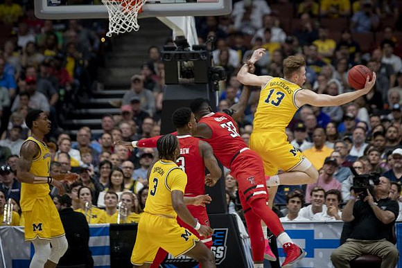 Charles Matthews (1), Zavier Simpson (3), and Ignas Brazdeikis (13)