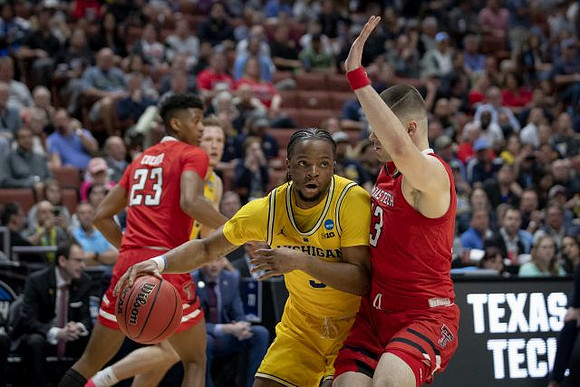 Ignas Brazdeikis (13) and Zavier Simpson (3)