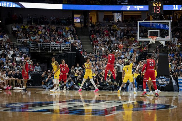 Charles Matthews (1), Jordan Poole (2), and Zavier Simpson (3)