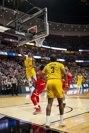 Charles Matthews (1), Zavier Simpson (3), and Jordan Poole (2)
