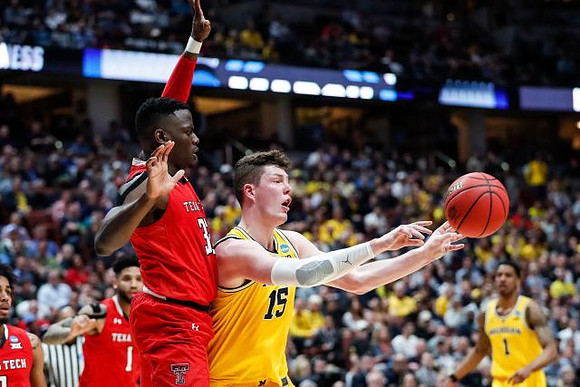 Jon Teske (15) and Charles Matthews (1)