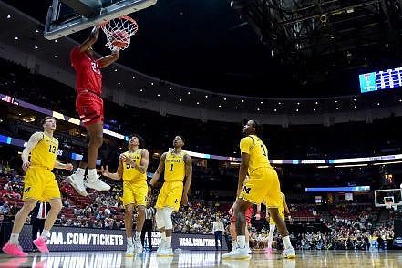 Ignas Brazdeikis (13), Eli Brooks (55), Charles Matthews (1), and Zavier Simpson (3)