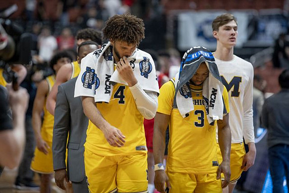 Isaiah Livers (4), Zavier Simpson (3), Colin Castleton (11), and Michigan Team