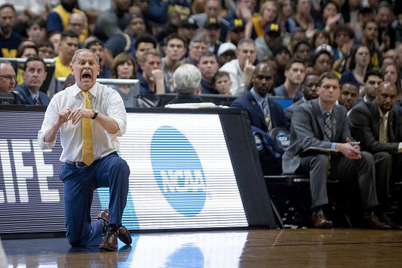 John Beilein, Luke Yaklich, and Saddi Washington