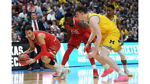 Jon Teske (15) and Charles Matthews (1)