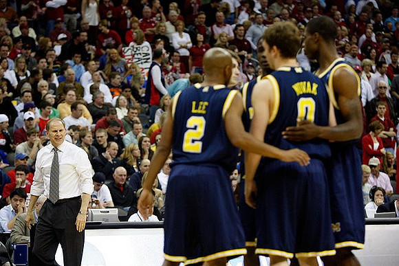 John Beilein, C.J. Lee (2), Zack Novak (0), DeShawn Sims (34), Manny Harris (3), and Stu Douglass (1)