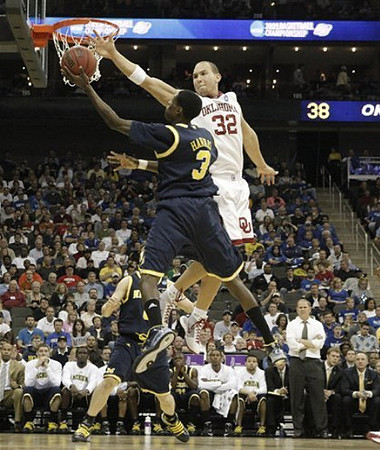 Manny Harris (3), Zack Novak (0), and John Beilein