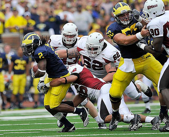 Vincent Smith (2) and David Molk (50)