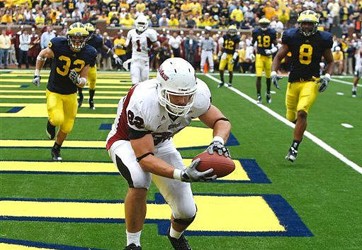 Jordan Kovacs (32), J.T. Floyd (12), Jonas Mouton (8), and James Rogers (18)