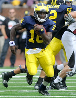 Denard Robinson (16) and Stephen Schilling (52)