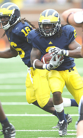 Denard Robinson (16) and Vincent Smith (2)