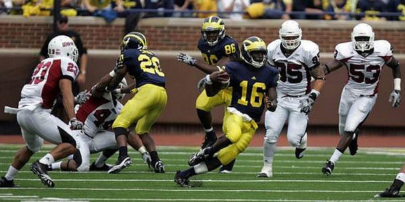 Michael Shaw (20), Denard Robinson (16), and Kevin Koger (86)