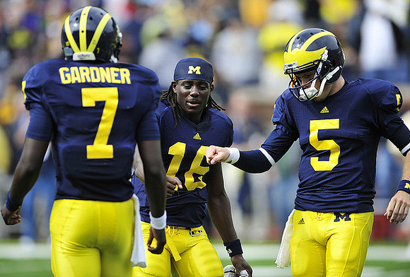 Devin Gardner (7), Denard Robinson (16), and Tate Forcier (5)
