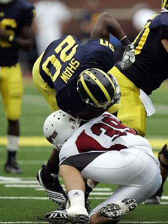 Michael Shaw (20) and David Molk (50)